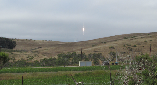 Watching a rocket launch a new satellite into orbit from Vandenberg Air Force Base.