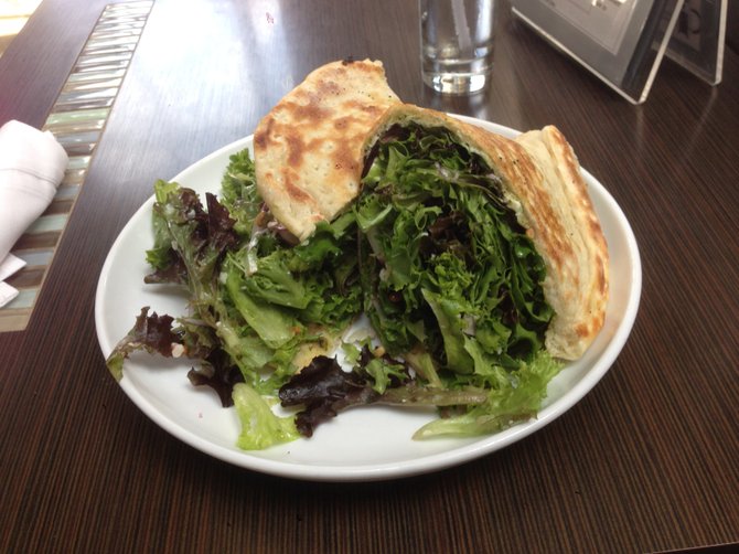 A surprisingly satisfying mouthful of organic greens. Pizza salad sandwich. D Bar.