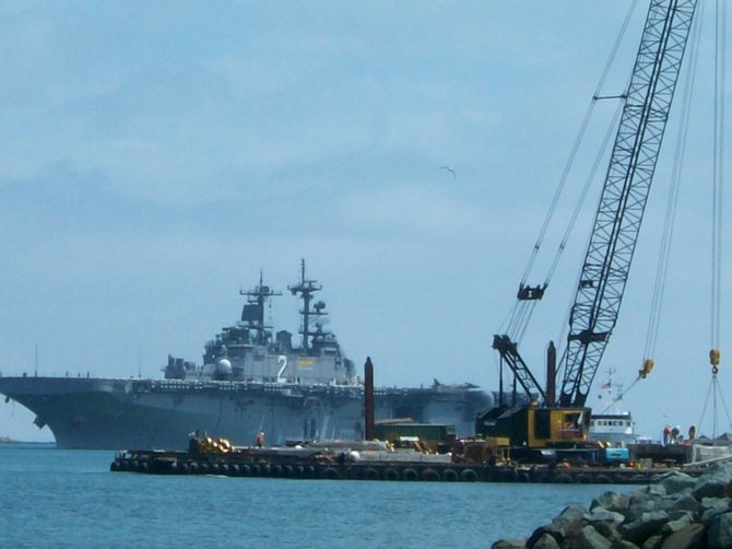 Navy ship arrives in San Diego Bay near Shelter Island.