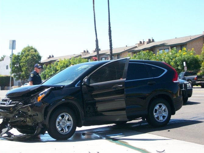 Honda SUV suffered front end damage and a shattered windshield.