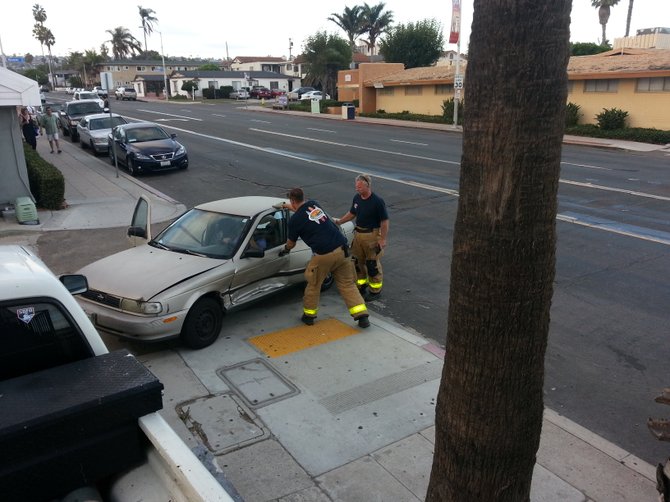 Firefighters work to free driver pinned in car after accident in Pacific Beach