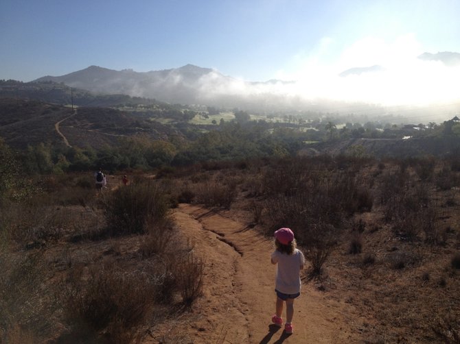 During the Kohn family hike in Poway hills, the morning fog rolls in over the Maderas golf course.