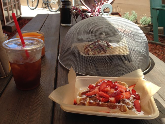 First waffle up, second on deck in the screen cake dome. Sweet and Savory waffles. Wow Wow Waffles.