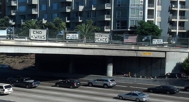 Protesters on an I-5 overpass downtown, September 11, 2014