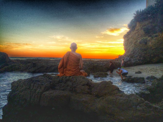 Buddhist Monk watching the sunset in Laguna Beach