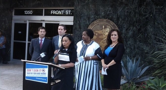 Councilwoman Myrtle Cole, flanked (left) by attorney Will Moore and senator Marty Block representative Chris Ward, and (right) assemblywomen Shirley Weber and Lorena Gonzalez
