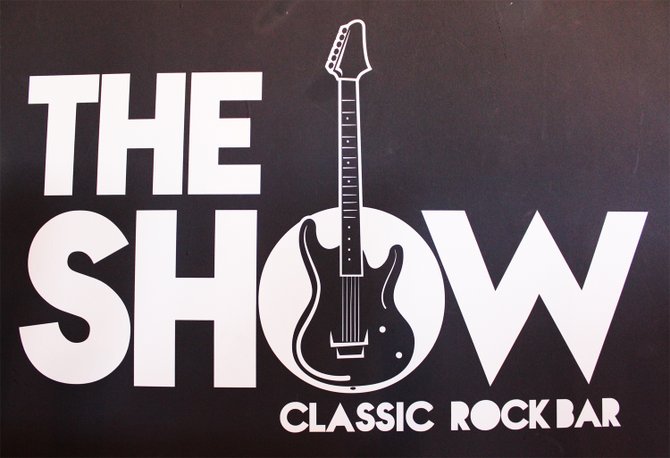 The logo for Mexicali craft beer bar The Show conveys its classic rock theme