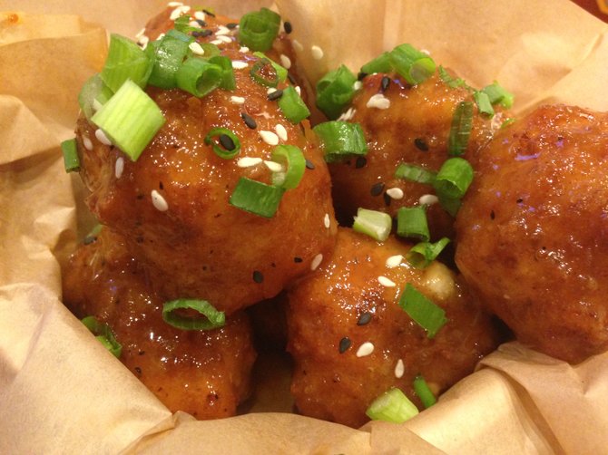 Crispy Cauliflower Bites at Veggie Grill come with a sweet and sour glaze