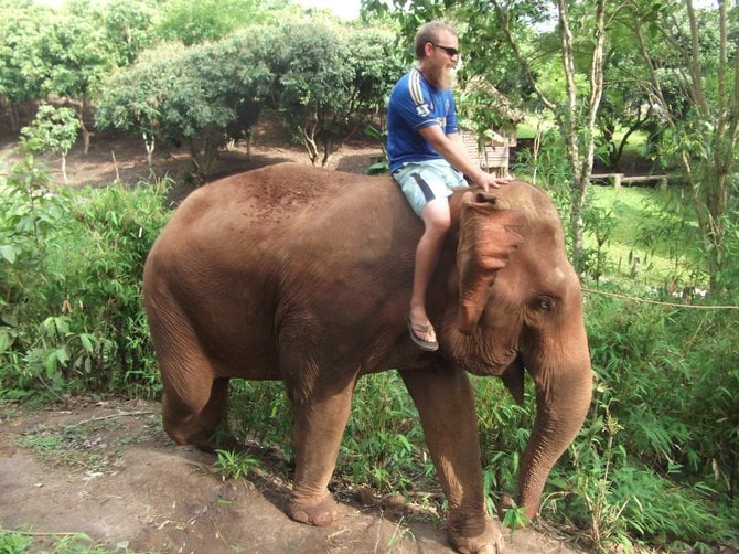 Riding an elephant outside of Mae Wang, Thailand.