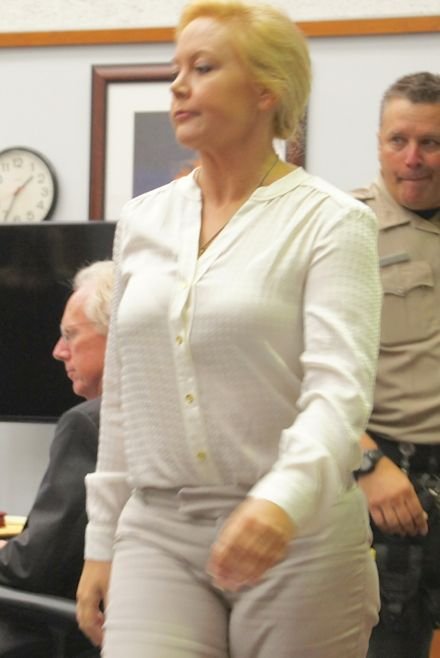 Defendant Julie Harper walks to the witness box. Photo by Eva