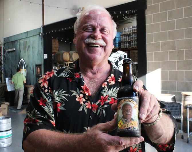 Long-time homebrewer Ken Schmidt poses with his mint chocolate imperial stout, brewed and bottled at Vista's Iron Fist Brewing Company - Image by @sdbeernews