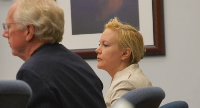 Attorney Pfingst and Julie Harper hear the verdict this morning. Photo by Eva
