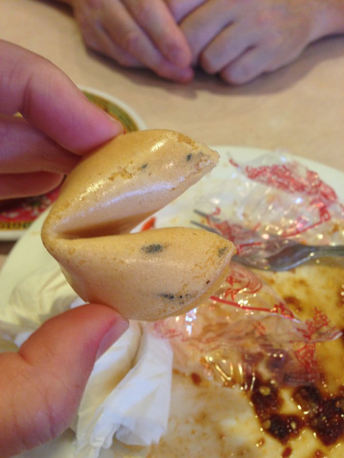Whatever that is on the fortune cookie, which was missing its other side. 
