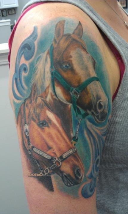This is a photo of two of my horses.  I wanted to make sure I would have them near me everyday.  After this tattoo was done, about a year later the paint mare passed away.  I am still able to look at her everyday and know she is still with me.  This tattoo was done by Karin Ackerman at Chronic Tattoo in Pacific Beach and she is an amazing artist.