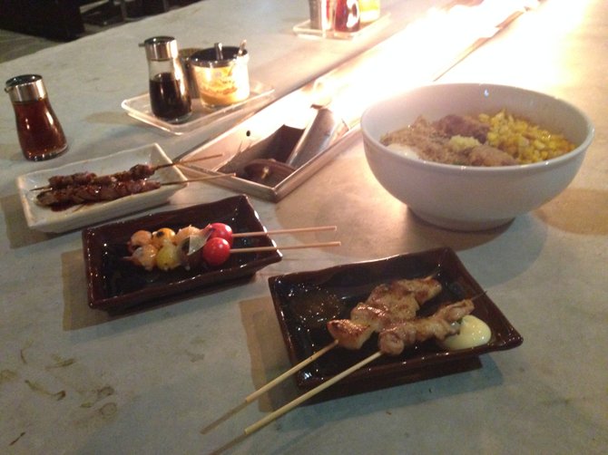 Chicken liver, heirloom tomato and pork belly yakitori, plus miso ramen. Underbelly.
