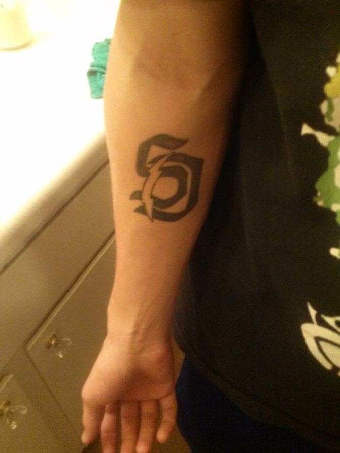 My name is stephen im 18. I live in vista ca. i got this tattoo cause its the best city in the world.and i had to add the charger bolt.