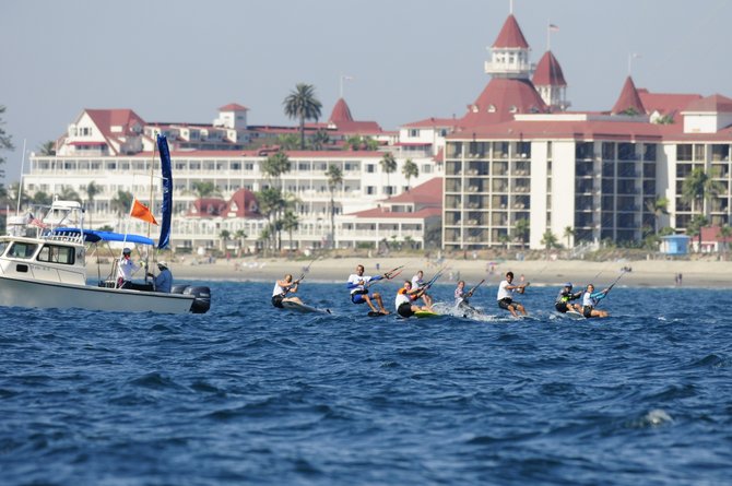 The kiteboarding fleet speeds across the water in front of the Hotel Del for the 2014 Kiteboard North American Championship.