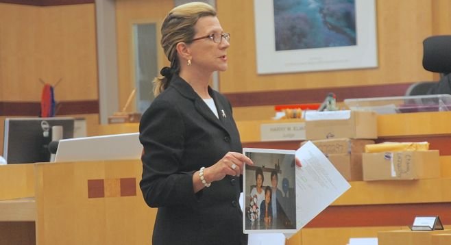Defense attorney Kathleen Cannon shows a picture of the Chang family in happier times, to the jury. Photo by Eva