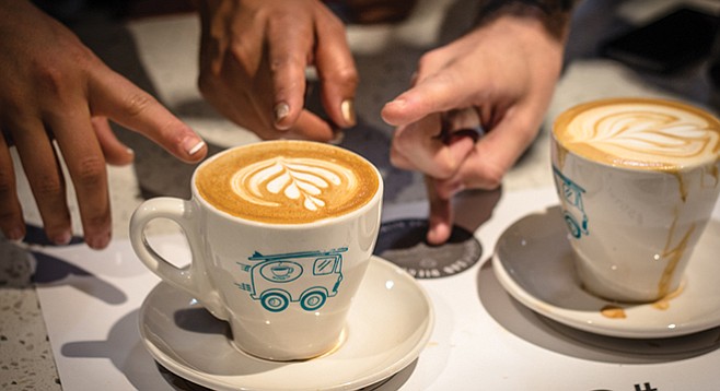 Judges pick winning latte art during the tulip round. - Image by Jared Armijo-Wardle
