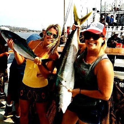 MY FIRST YELLOWTAIL!
I am the one with the big one on the right! Caught this beauty on one of the Seaforth day trips out of Dana Landing.  It was my first time "deep sea" fishing.  Caught this baby on the kelp patties outside of Point Loma.  I went from one side of the boat to the other, and after lots of bicep assistance from my beautiful friend beside me, and 25 mins later, I had this beauty to take home and make some sushi out of.  I was very proud!  :)

Sarah