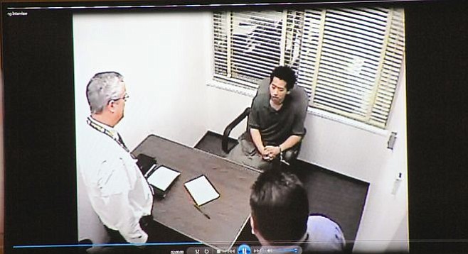 Detectives interviewing Bryan Chang