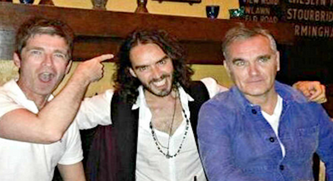 Gallagher, Brand, and Moz enjoy a pint at the Hollywood hangout for British ex-pats the Cat and Fiddle.