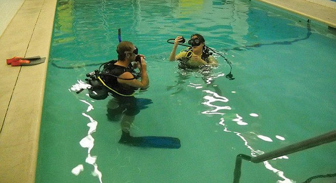 Jason in the pool with Chrissy for a recertification course
