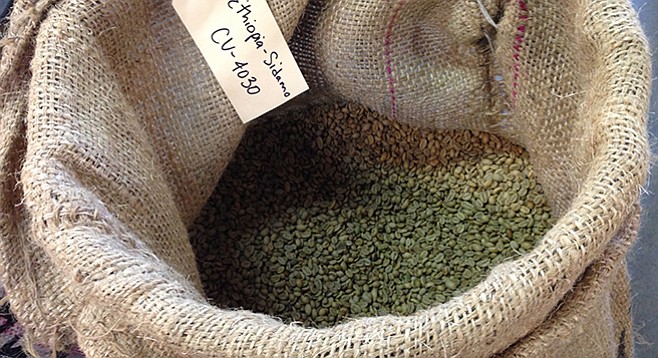 A sack of green coffee beans at Café Virtuoso