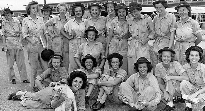 Members of the first class of WAVES to graduate from the Aviation Metalsmith School, at the Naval Air Technical Training Center, Norman, Oklahoma, 30 July 1943