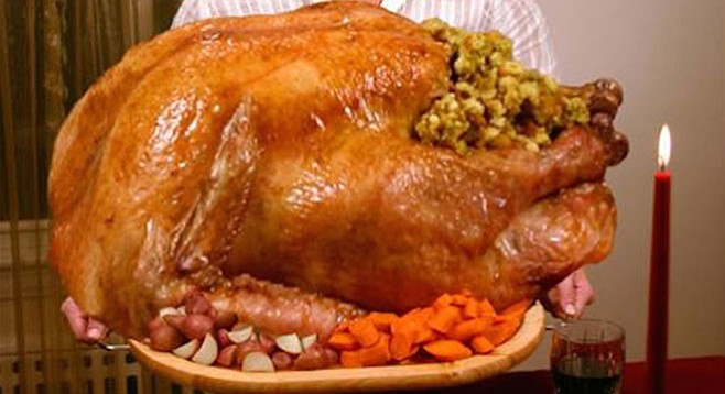 With three hours and nine minutes of TV ads, football fan, you should have plenty of time to carve the bird.
