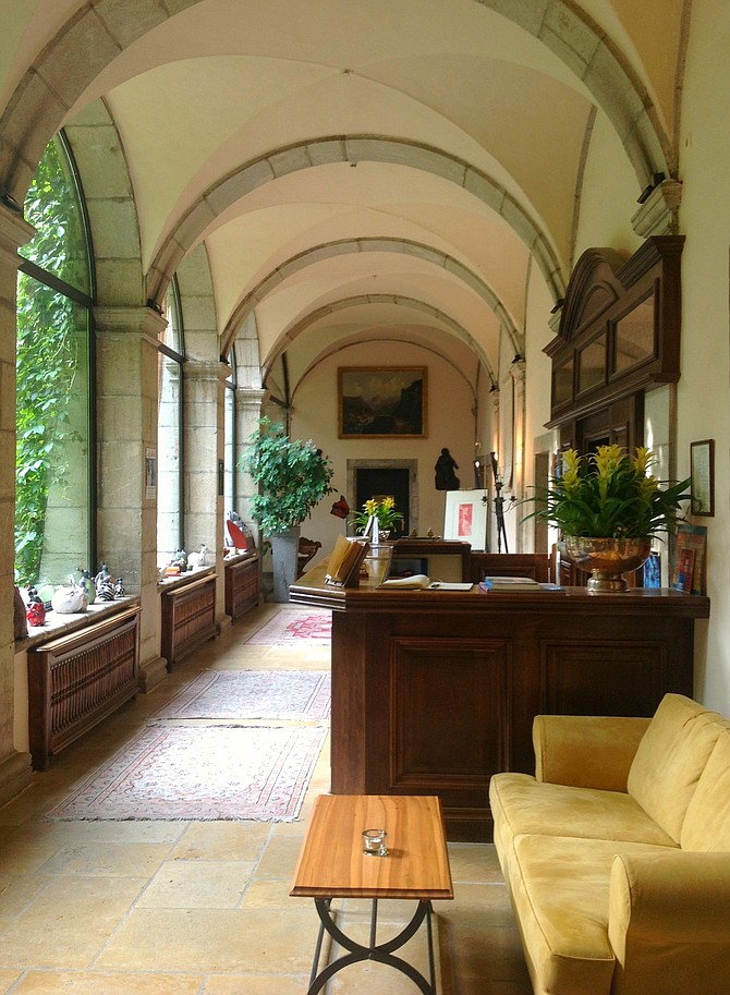 The medieval entrance of the former monastery  now turned lobby of L'abbaye de Talliores