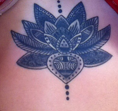 This is my lotus flower on my sternum. 
It symbolizes the life of a lotus: grows in the dirt underwater and when it is mature it rises to float beautifully atop the pond. 
I can relate to a lotus and their meaning with my own life, which is why its in the center of my body. 
I love getting to show my art with my dancing career and am not done with tattoos yet.