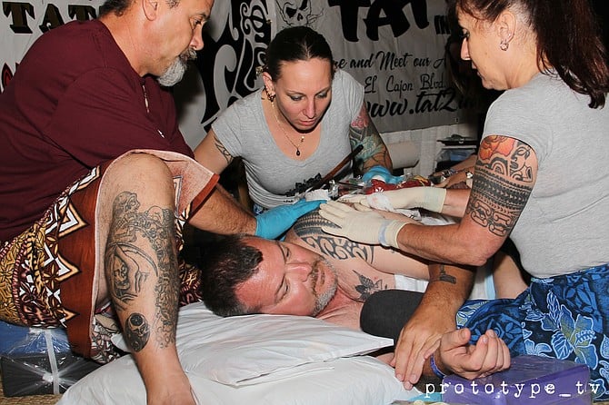 I caught my homegirl, Sulu'Ape Angela, and her friends, performing "tapping," and old-school style of tattooing from Samoa. This was photographed at the San Diego Concourse.