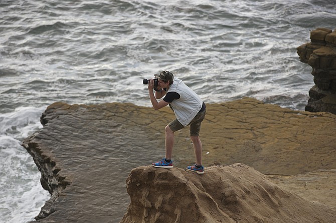 The daring photographer. Point Loma light house