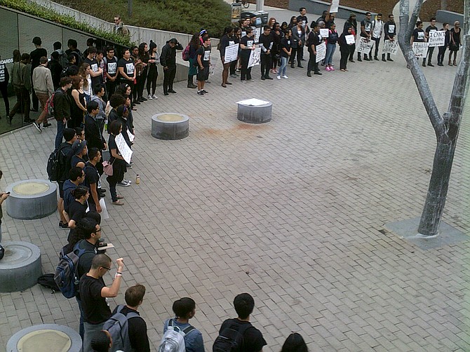 Students engaging in 4 1/2 minutes of silence for Michael Brown. UCSD Theodore Geisel Library. Fri. Dec. 5, '14, 1:30 pm