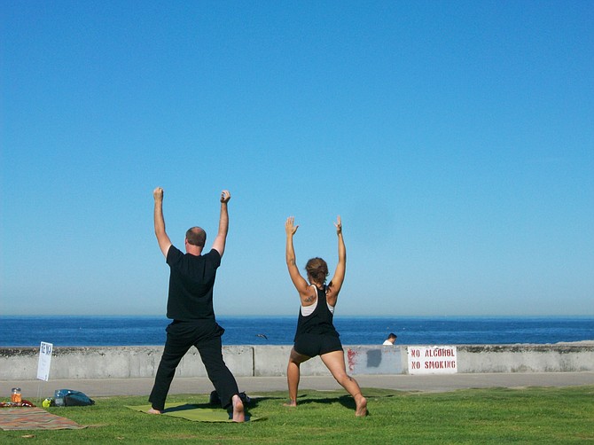 Yoga devotees getting spiritual exercise in Ocean Beach.