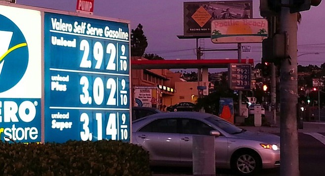 Dueling gas stations at the corner of Ingraham and Grand battle daily for lowest price.