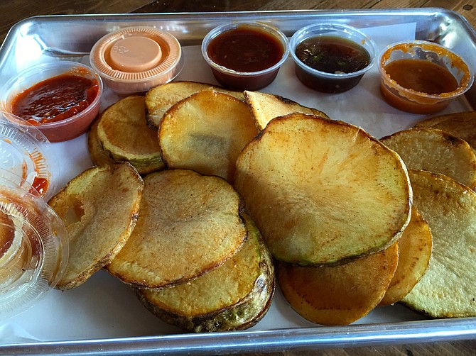 Thick chips with dipping sauces.