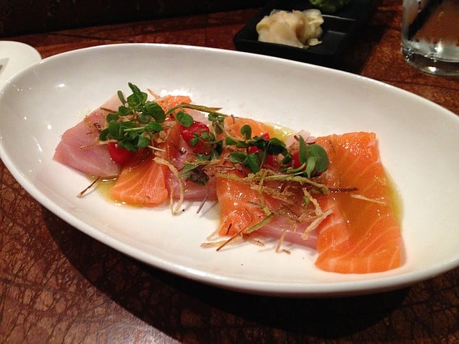 Sashimi of the day: yellowtail and salmon with fried leeks, tomatos and citrus chile sauce. Kappa Sushi.