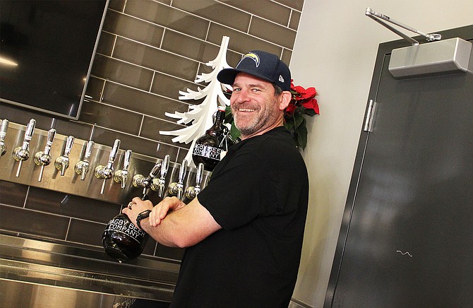 Bagby Beer Company owner and brewmaster Jeff Bagby filling growlers at his Oceanside brewpub - Image by @sdbeernews