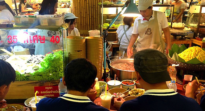 Taking in the savory sounds and smells of Bangkok street food.