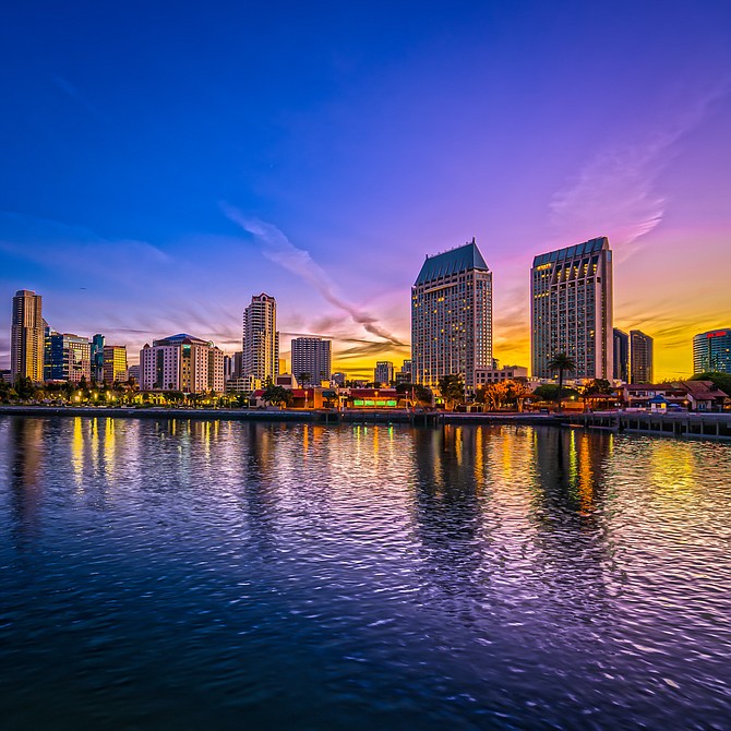 5 shot HDR of San Diego. Shot from some pier on the San Diego Bay (to the left is Seaport Village. Sunrise on 12-28-2014
