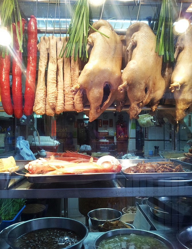 Simply being direct, many restaurants in Hong Kong hang their delicatessen by the front window to show how yummy it is.