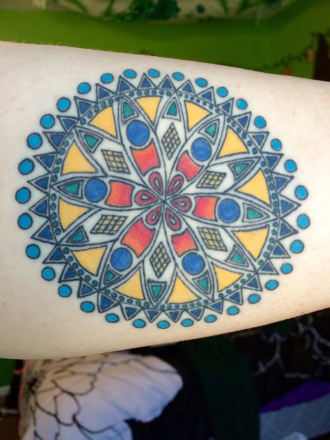 I'm 19 years old and live in Bonita, CA. I got this mandala this past Valentine's Day at Sacred Tattoo in Oakland by Karl. Firstly, I just loved the symbol; it can mean so many different things and it really is what you make of it. It represents a time in my life where I had to grow up and I was on my own, and it'll also be a constant reminder of all the good that happened while I lived in the Bay Area. Currently, I'm a college student and amateur blogger.