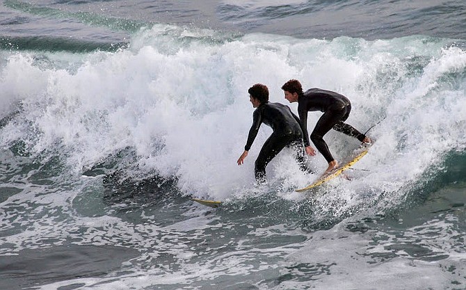 Surfing off of Oceanside Pier is a friendly sport.

 
