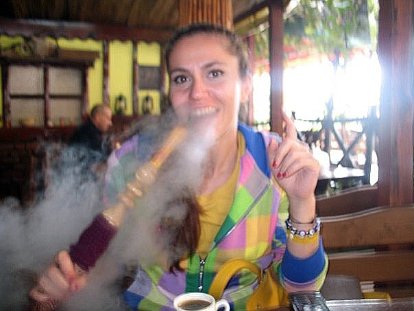 Saba smokes a hookah with her Turkish coffee