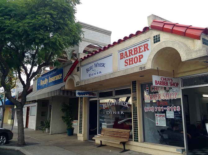 Bleu Whisk and longtime building-splitter, Chuy's Barber Shop
