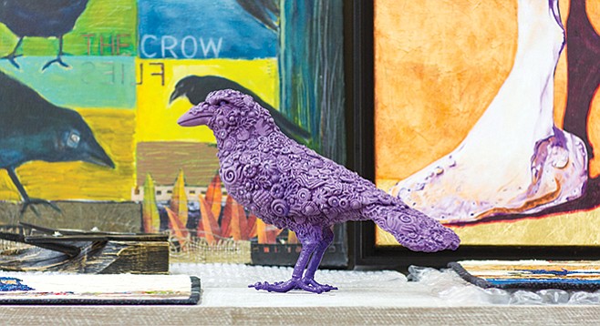 Karla Walter’s purple ceramic crow resides at the Studio Door.
