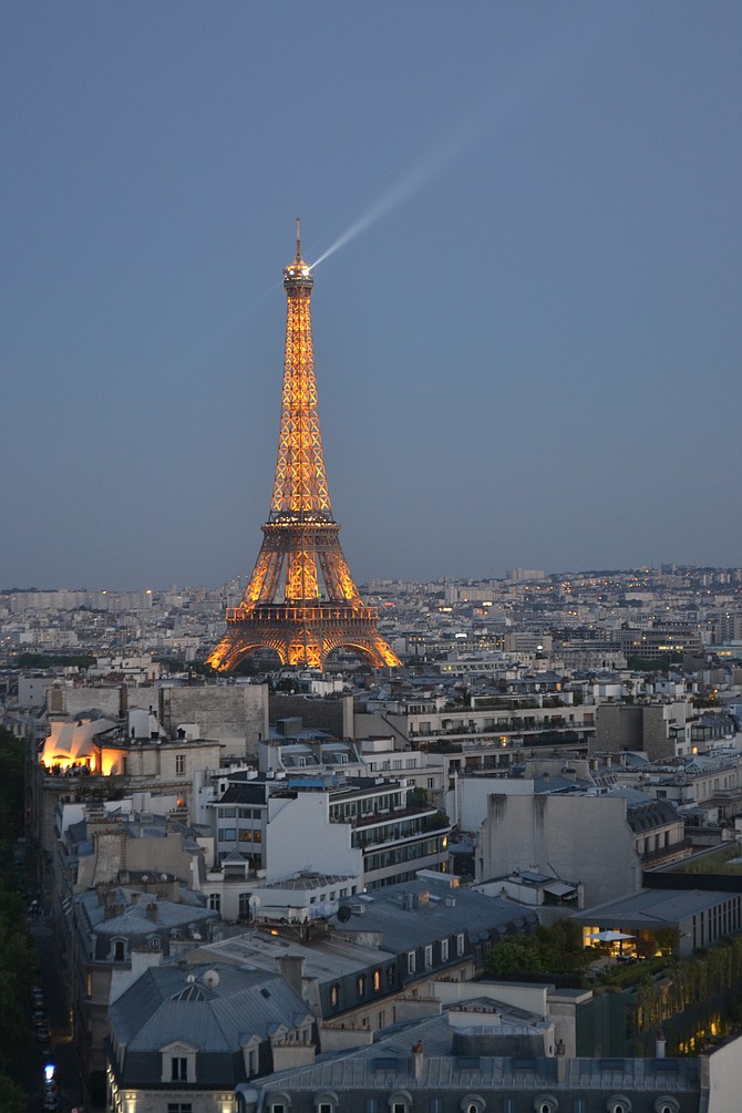 A summer sunset overlooking Paris, France and the lovely Eiffel Tower... amazing view and trip overall!