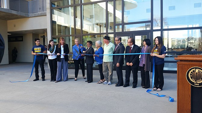 Students and faculty members cut the ribbon at Mesa College's new Social and Behavioral Sciences Building.